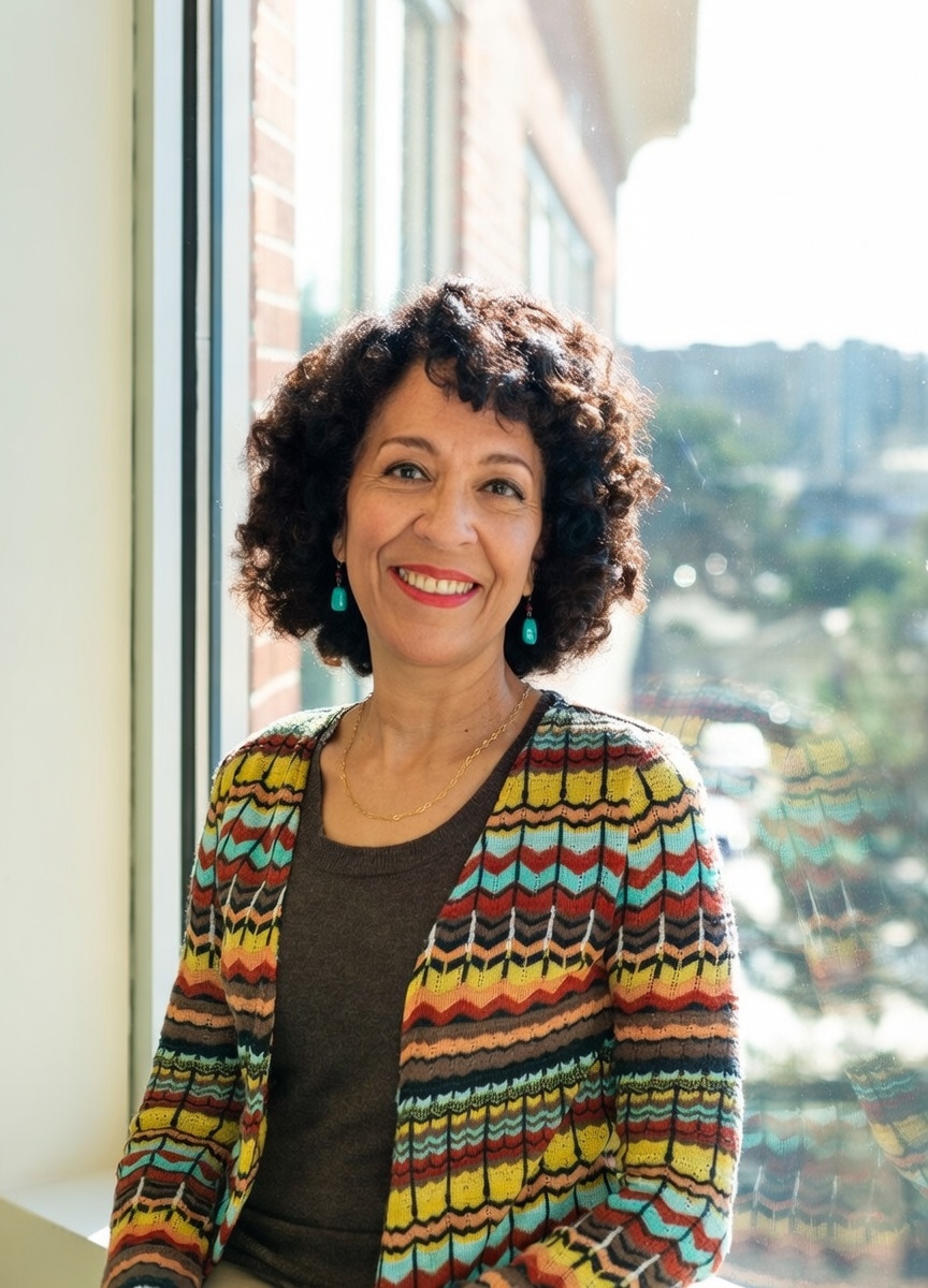 Headshot 2 standing by window_Julie Lange