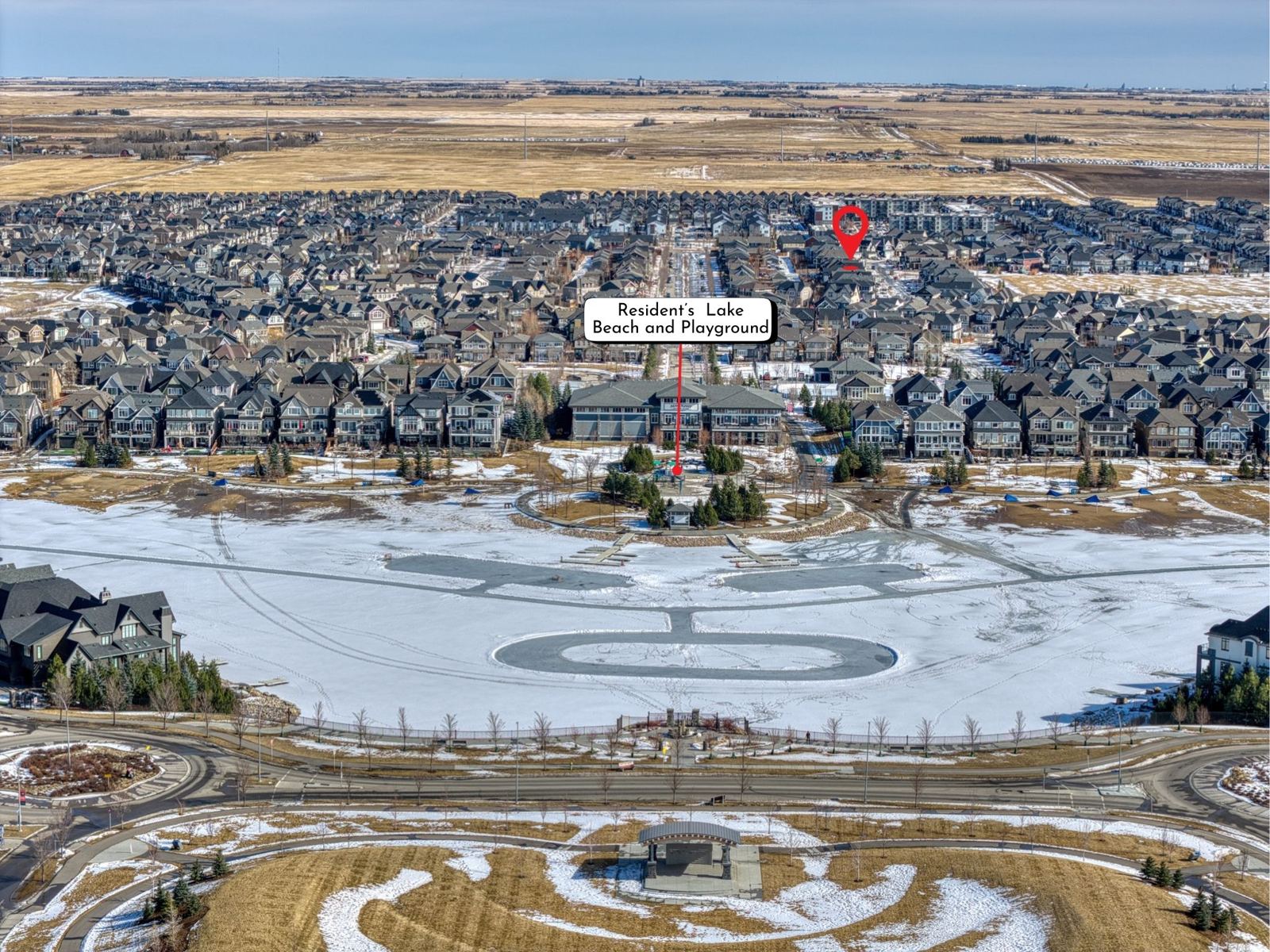 Aerial view of Mahogany in southeast Calgary, showing the residents' lake beach and playground