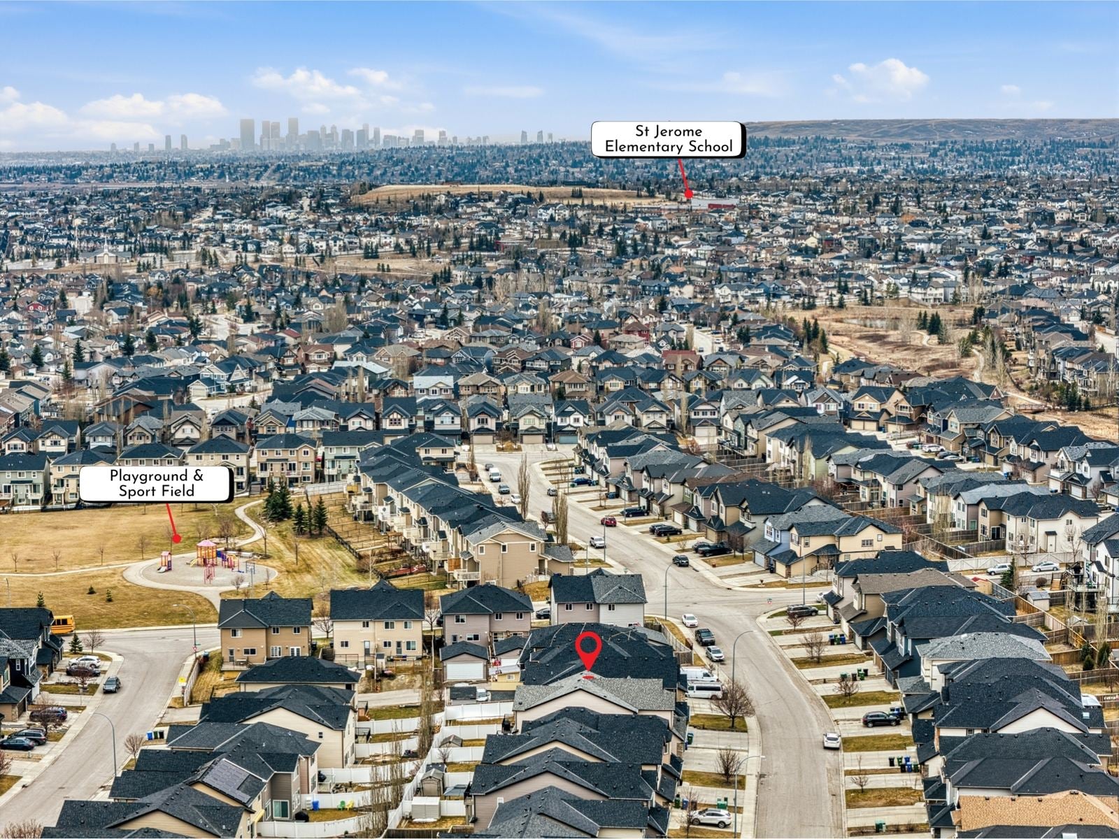 Aerial view of Panorama Hills in northwest Calgary, with a playground and St. Jerome Elementary School labelled