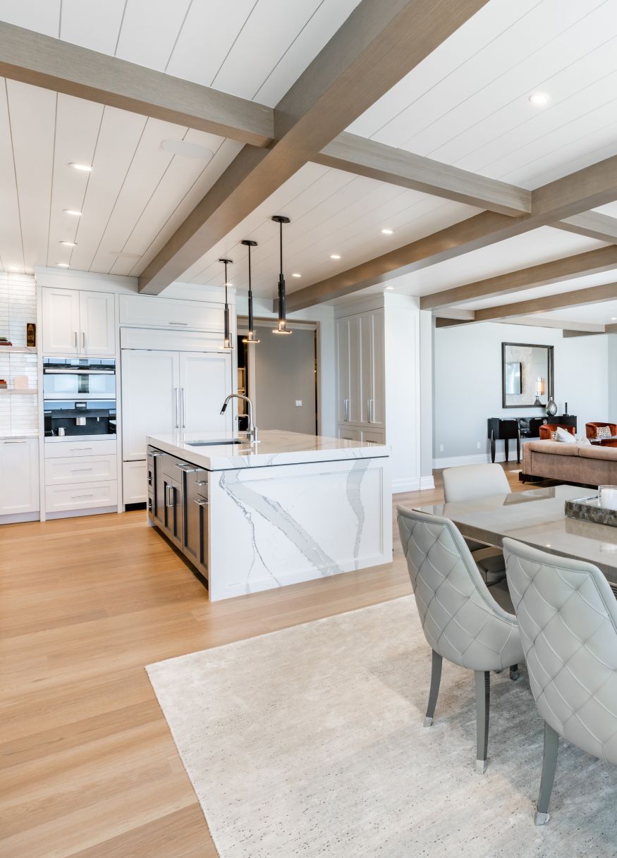 Luxurious high end kitchen with stainless appliances marble and glass tile