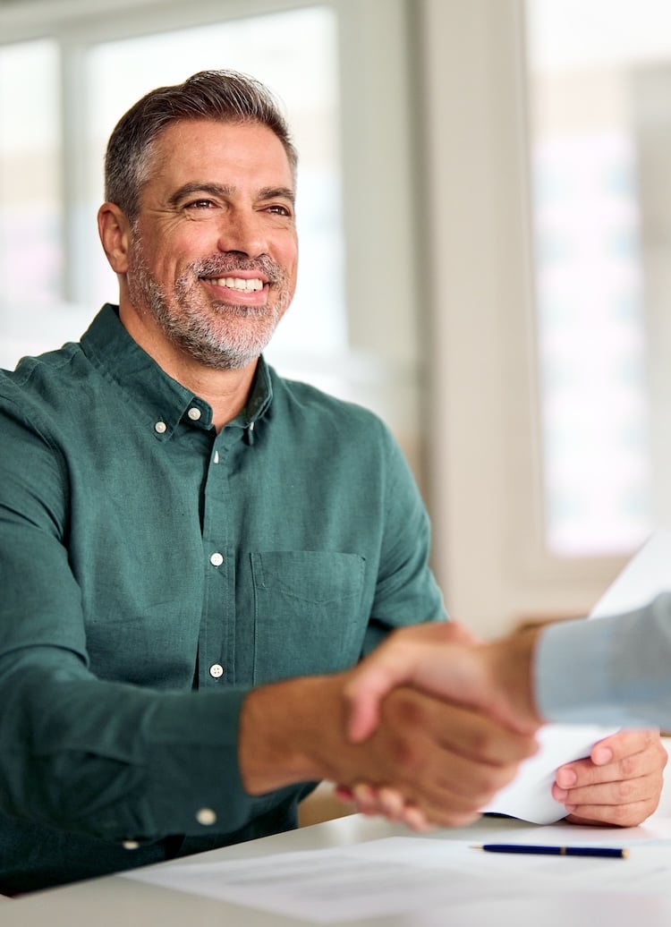 Smiling middle collaboration agreement at office meeting, hr manager and new worker shake hands recruiting at job interview. Welcome onboarding