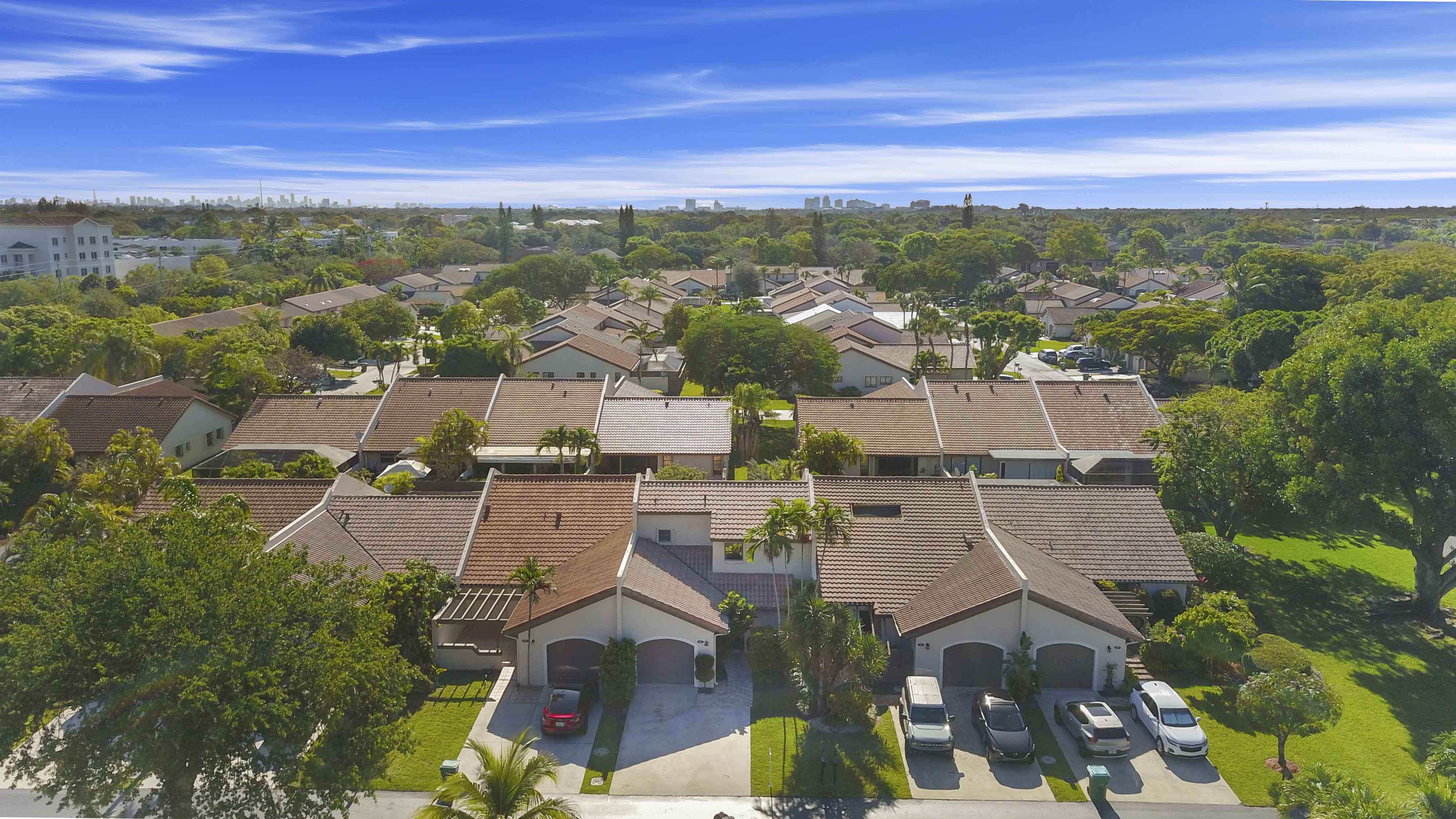 Low maintenance homes Miami gated community entrance, Labrada Realty