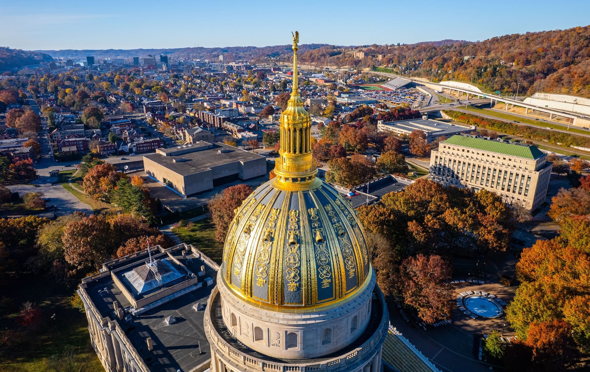 An aerial view of the West Virginia State Capitol Building and downtown Charleston with fall foliage (1)