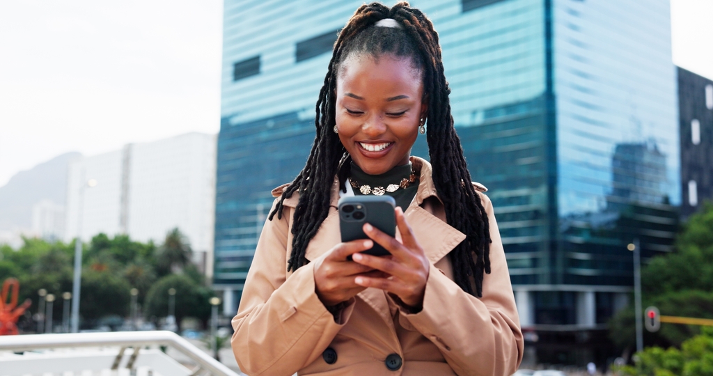 Real,Estate,,Smile,And,Black,Woman,In,City,,Smartphone,And