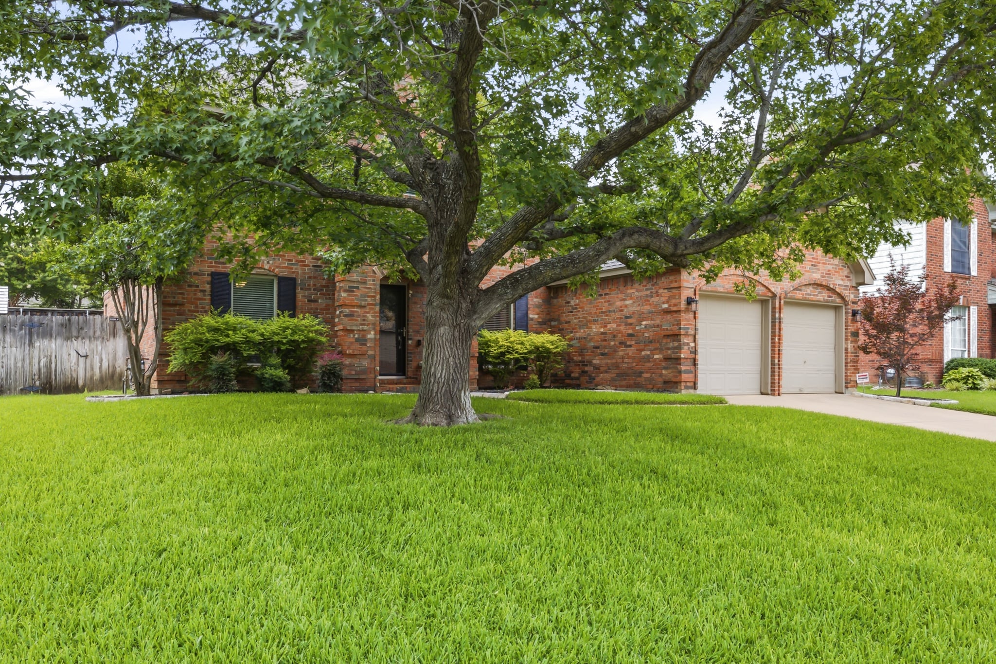 Two-story brick home with flagstone patio in Grapevine, Texas, listed for buyers relocating to DFW