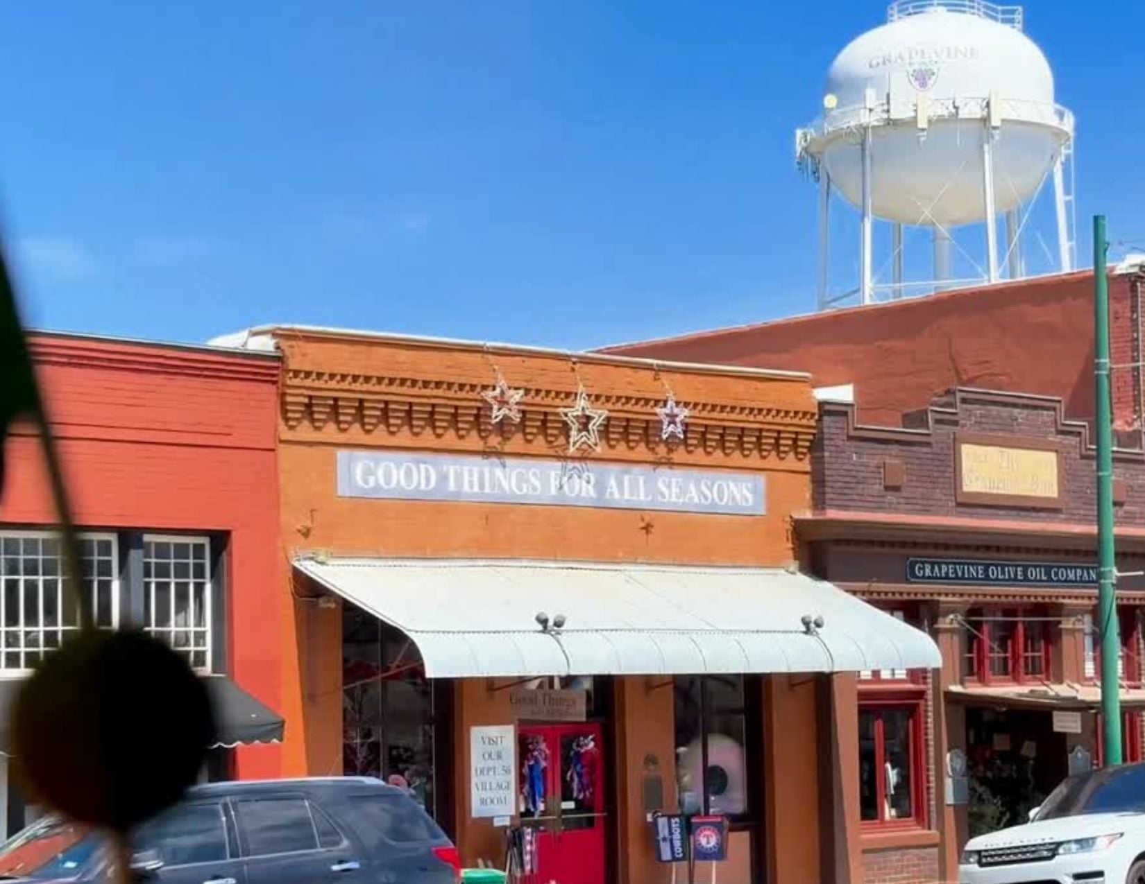 Historic Main Street Grapevine TX storefronts on a sunny Saturday morning, one of the best things to do in Grapevine TX
