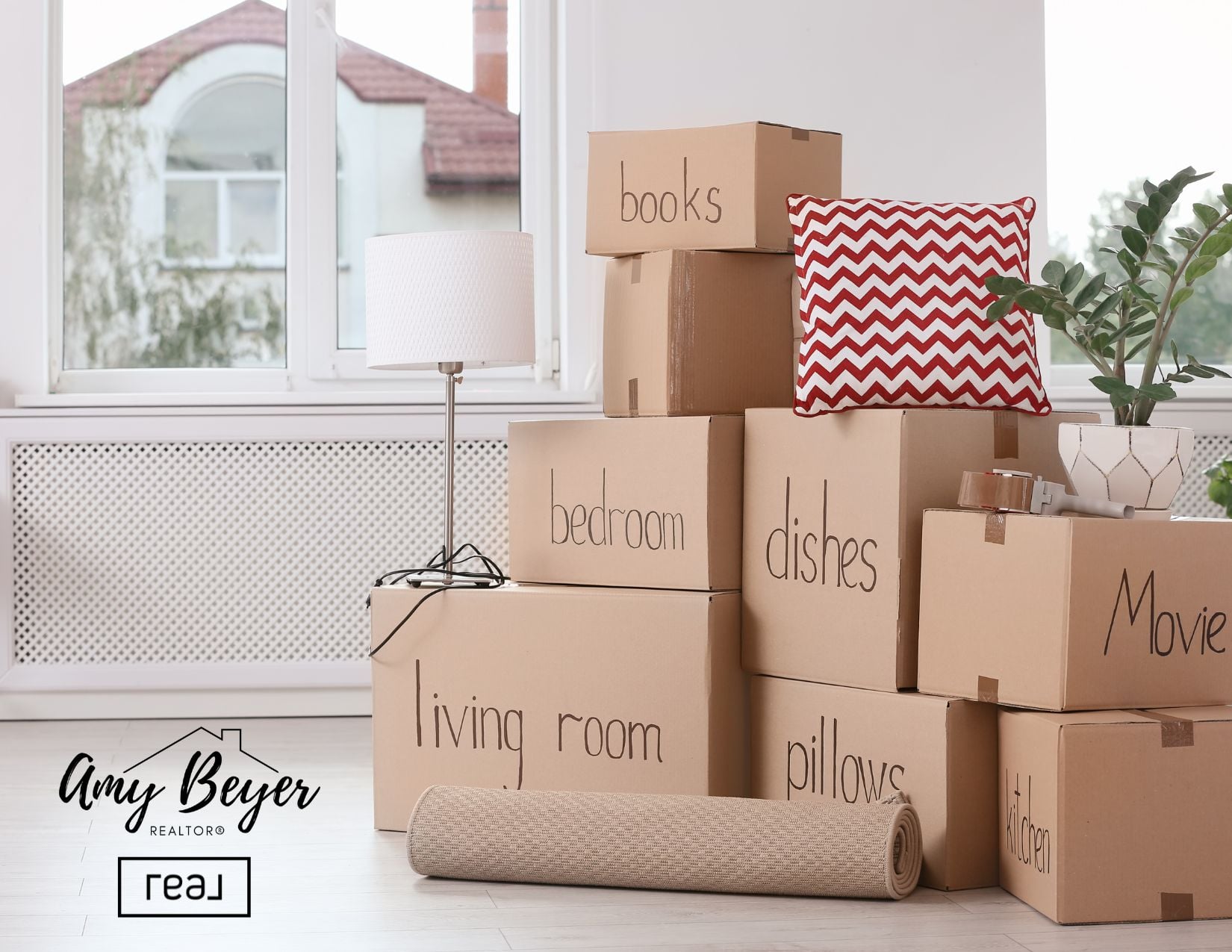 Moving boxes stacked by a sunlit window, the first step of rightsizing in Grapevine TX