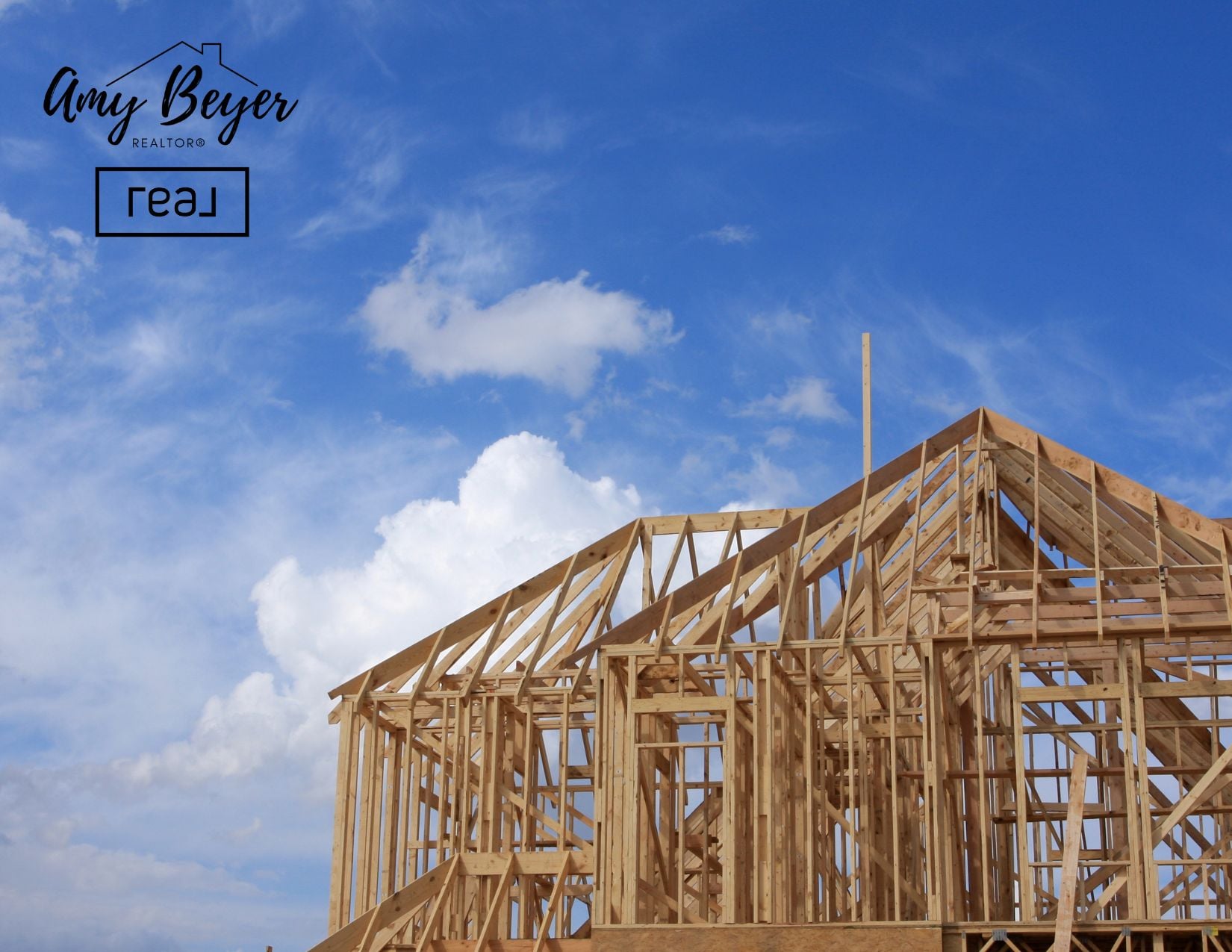 Newly framed home under construction against a big Texas sky, new construction in Fort Worth