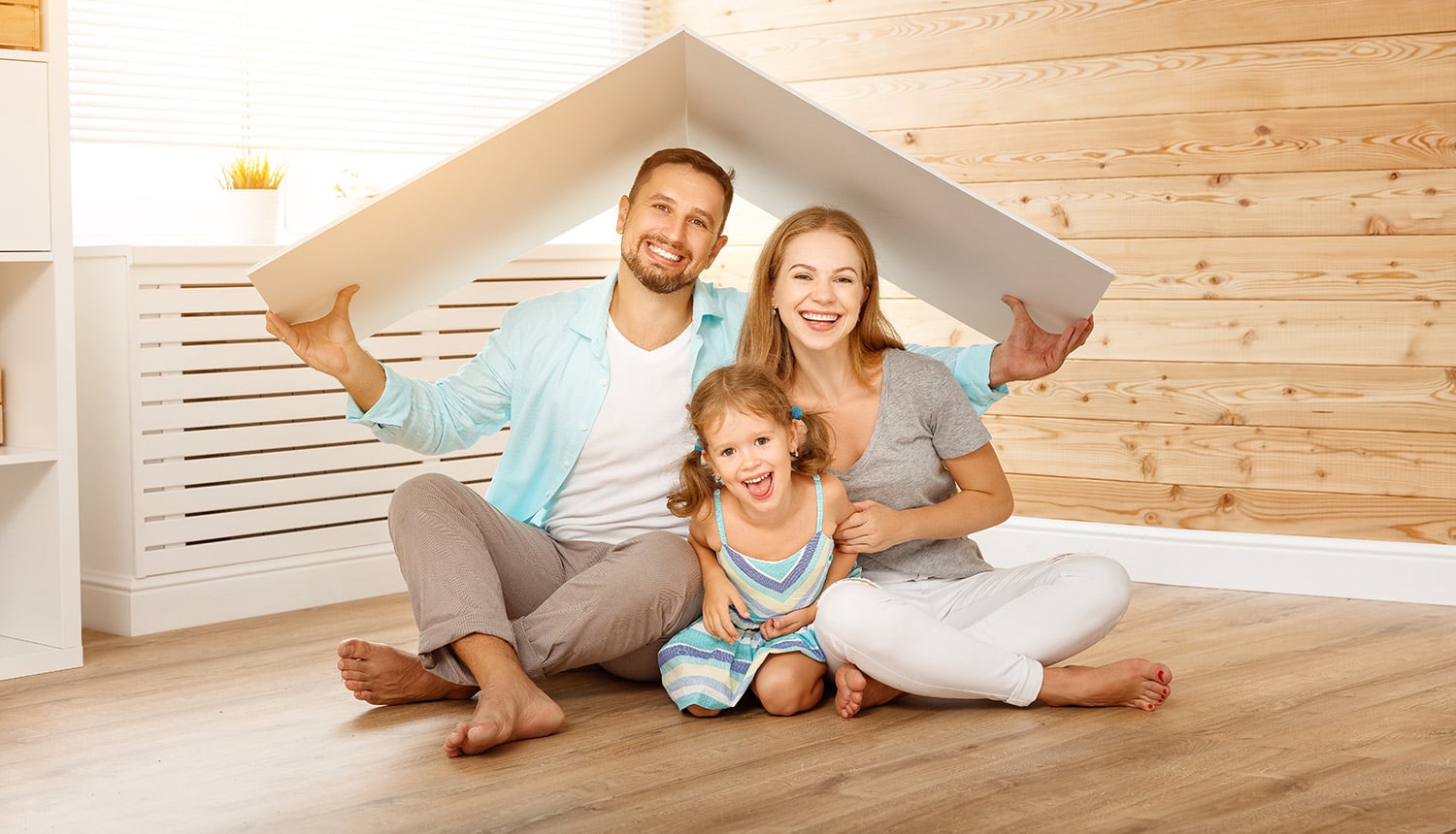 Concept,Housing,A,Young,Family.,Mother,Father,And,Child,In