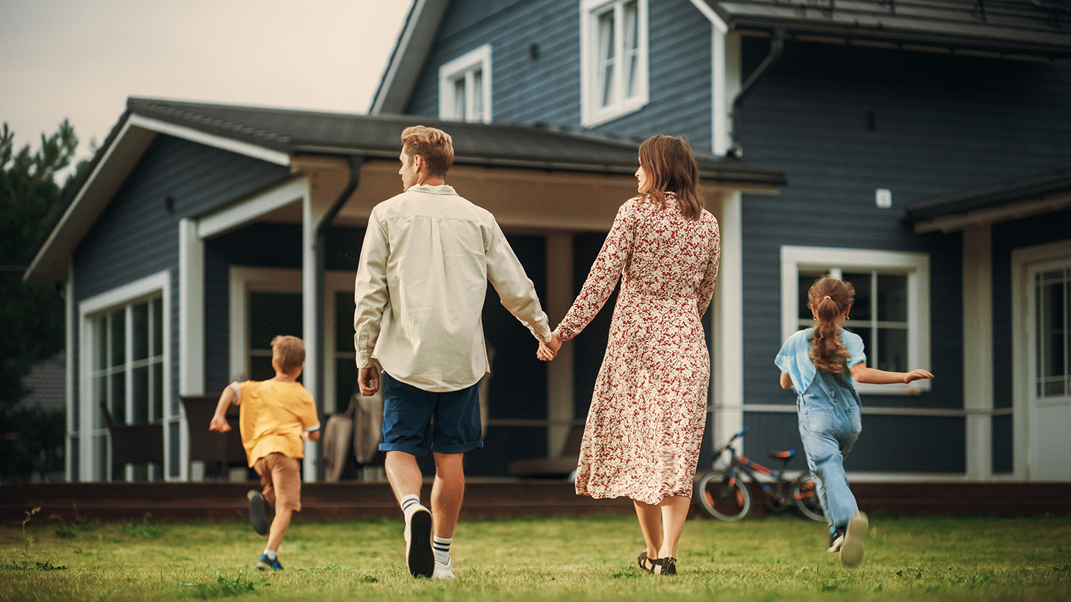 Young,Beautiful,Couple,Walking,Outdoors,Towards,The,Country,House,,Holding
