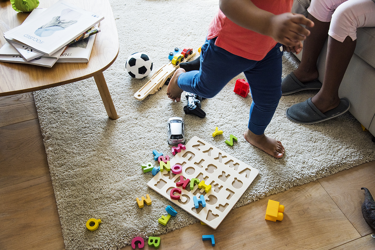 Kids playing toy in living room