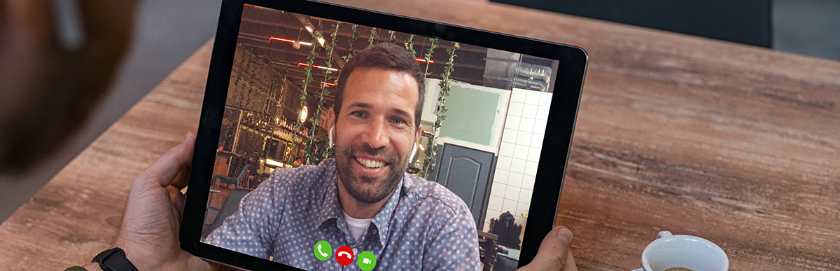Man doing video call on tablet