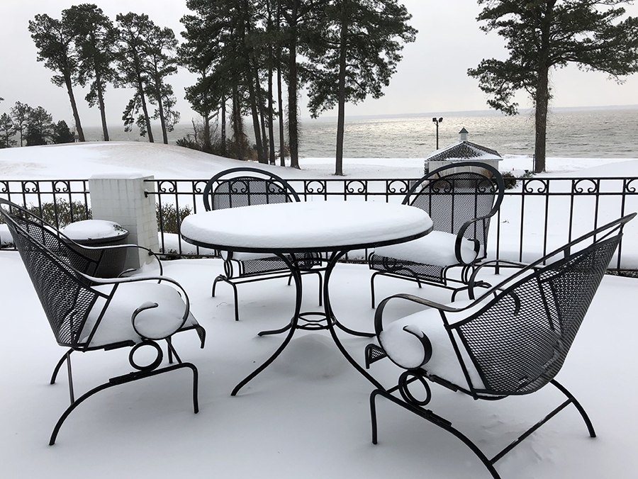 let-it-snow-a-patio-furniture-covered-by-snow-and--4GJ38PM