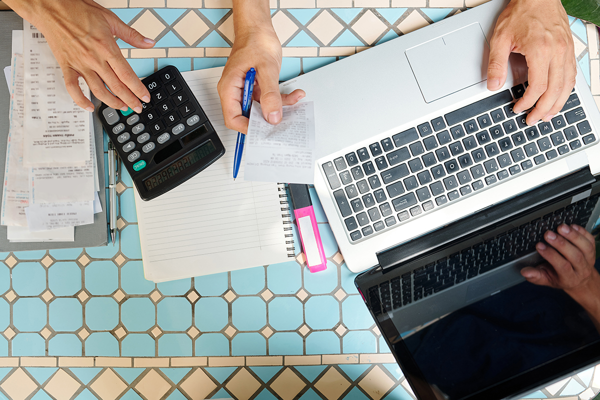 Business people paying bills online