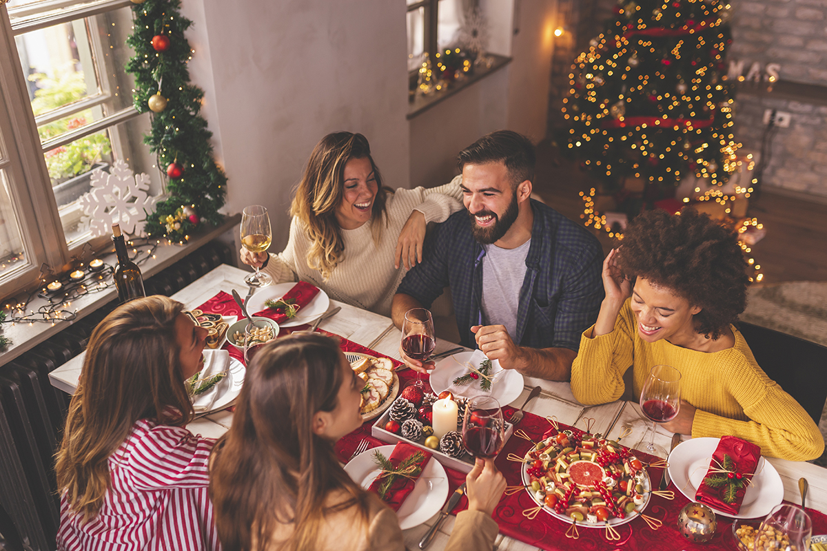 Friends having Christmas dinner