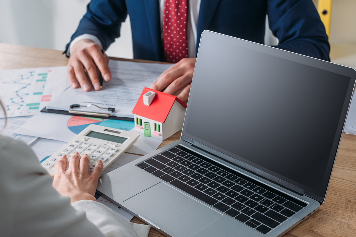 cropped shot of man studying loan agreement and businesswoman us