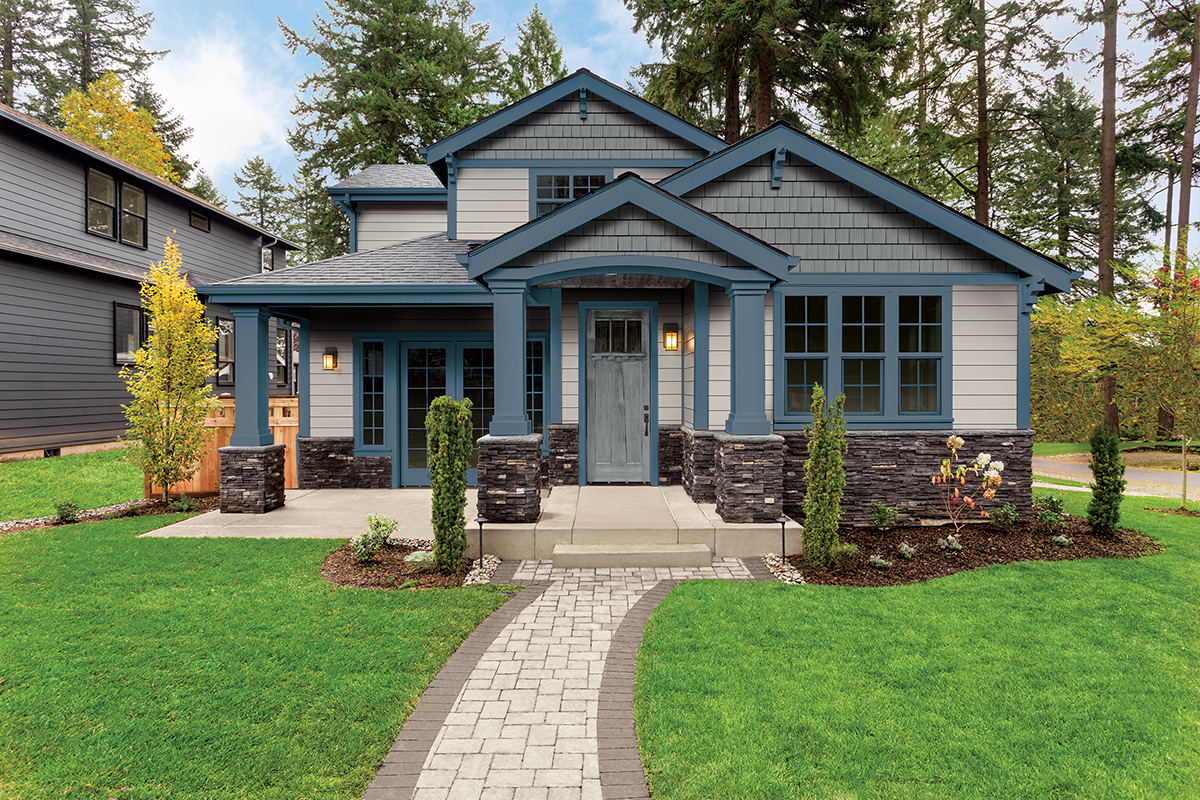 Beautiful Luxury Home Exterior with Green Grass and Landscaped yard