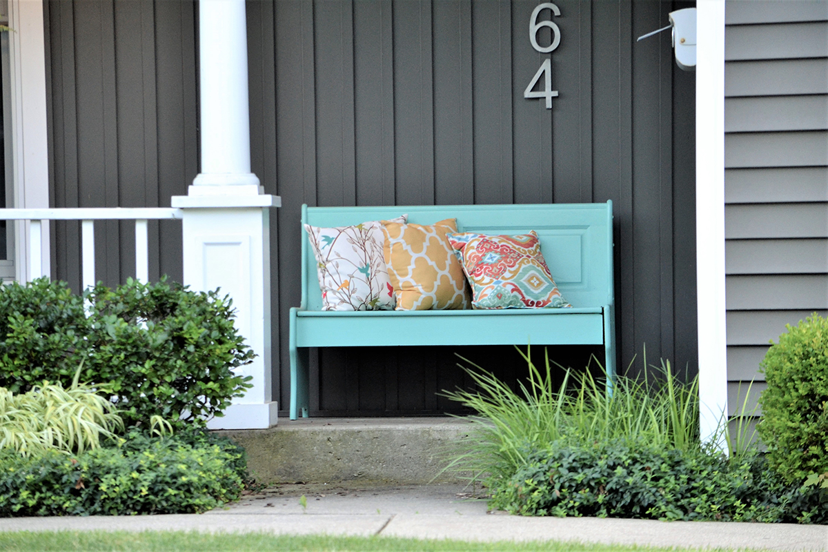 painted-bench-and-decorative-pillows-on-the-front-2022-11-16-06-14-20-utc