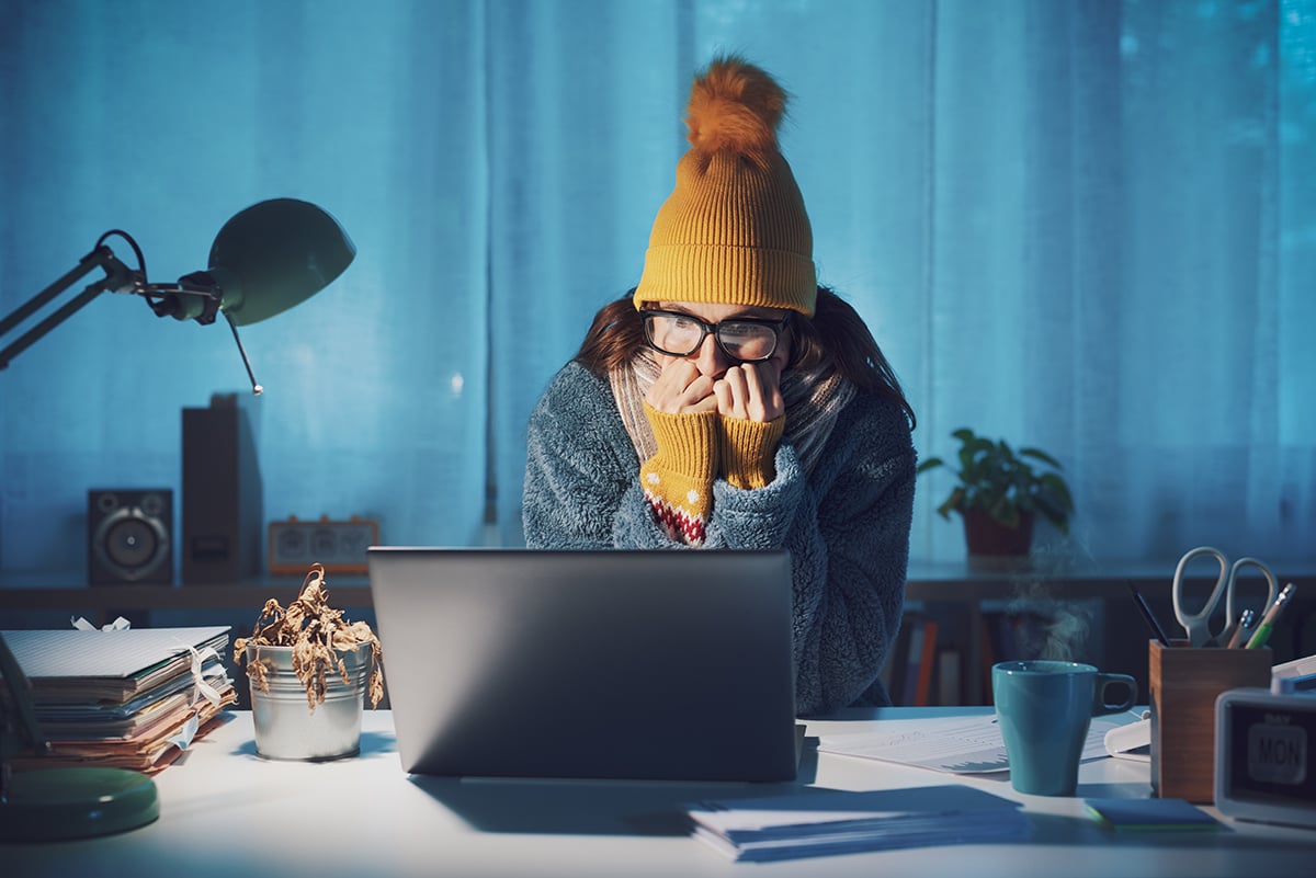Woman feeling cold at home in winter