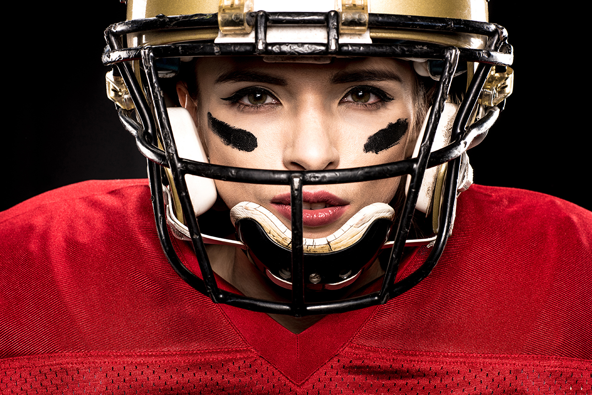 Close-up portrait of female american football player in sportswe