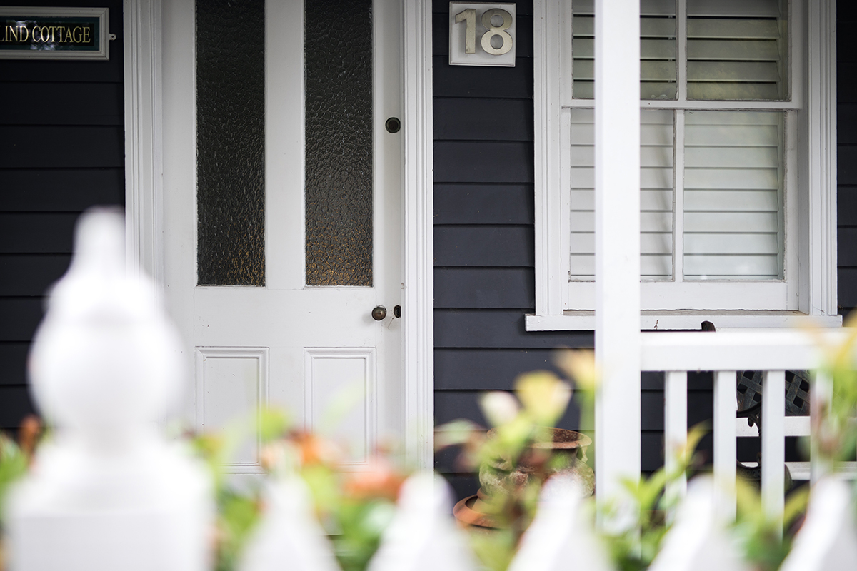 front-of-cute-timber-home-cottage-in-local-street-2023-11-27-05-08-04-utc