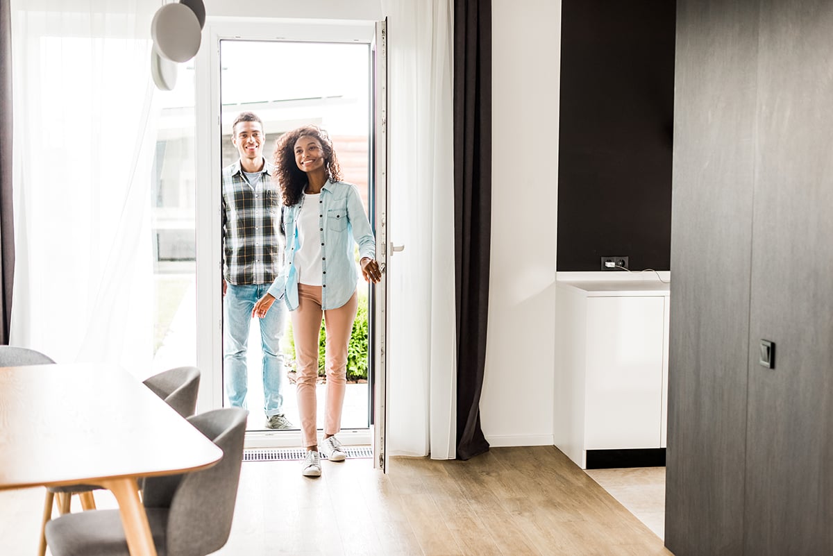 full length view of african american husband and wife smiling wh