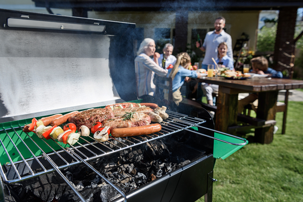family spend time together at barbecue. Selective focus of meat