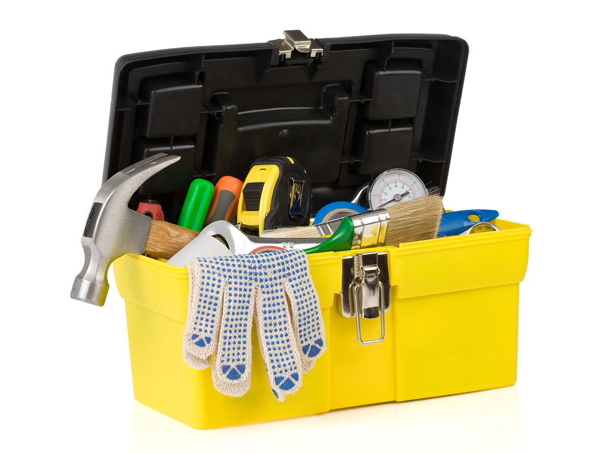set of tools on toolbox isolated at white