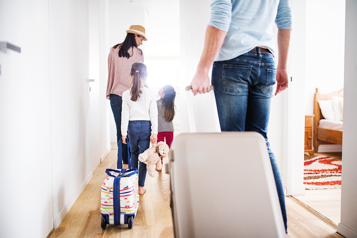 Young family with two children going on a holiday.