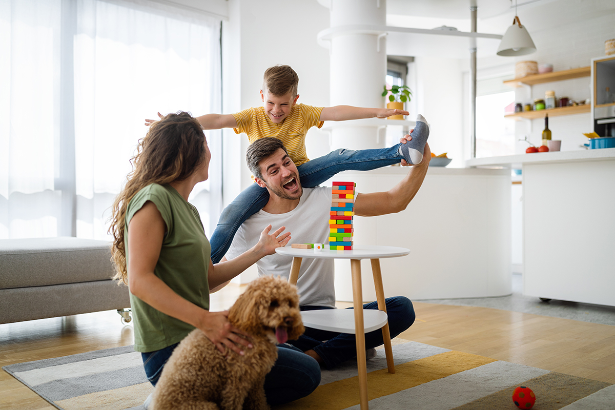 Happy young family having fun together at home. Happy childhood concept