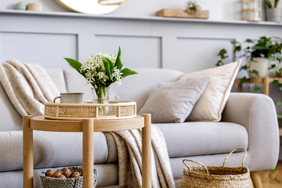 Scandinavian living room interior with design grey sofa, wooden