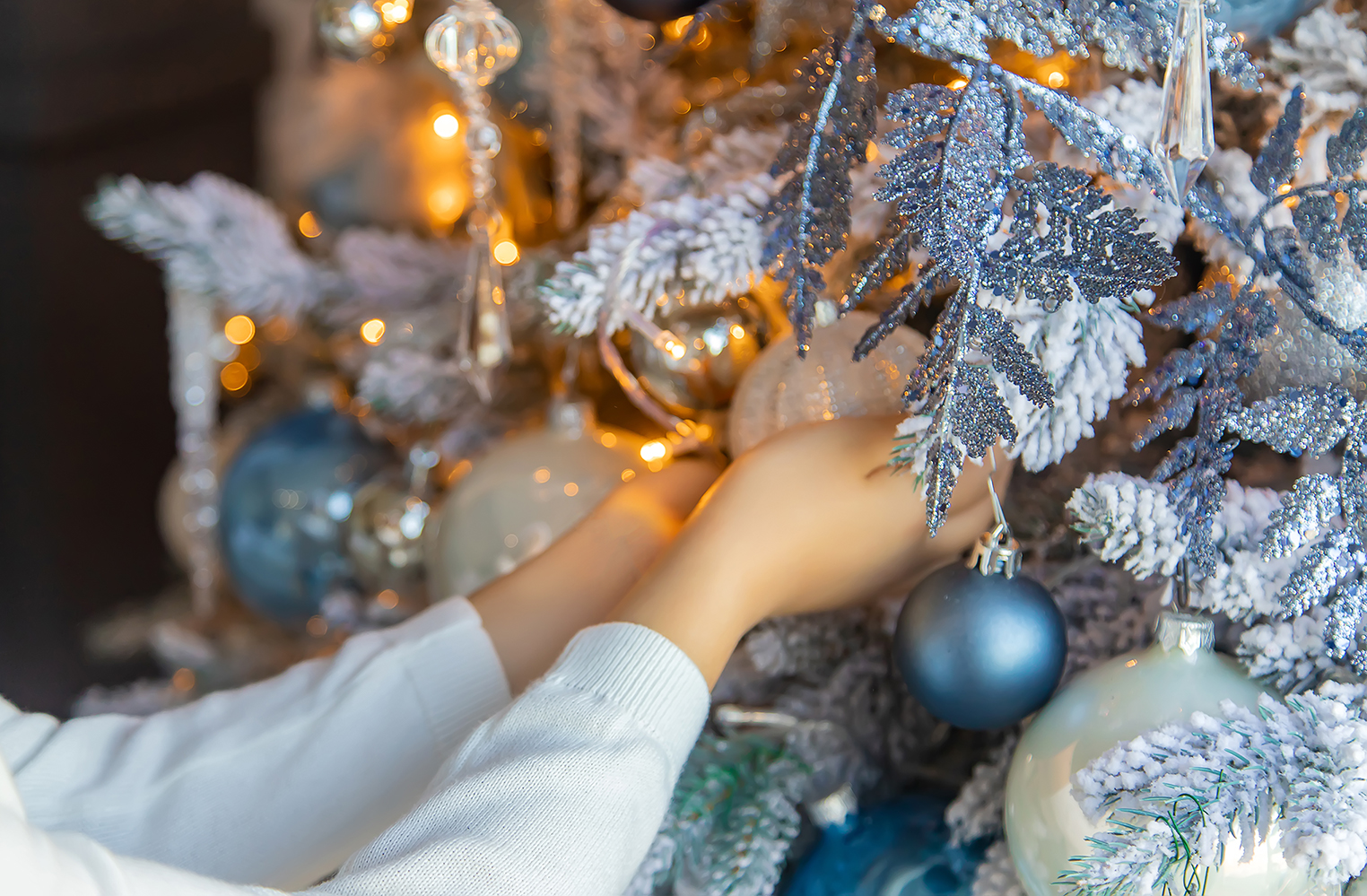 Christmas photo child decorates a Christmas tree. Selective focus.