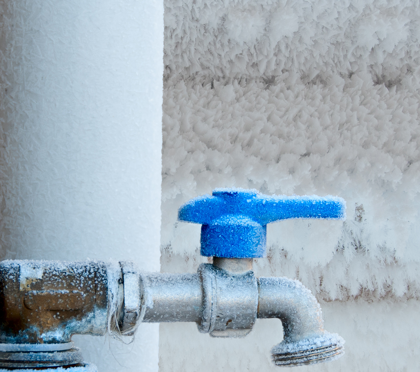 Frozen faucet in winter