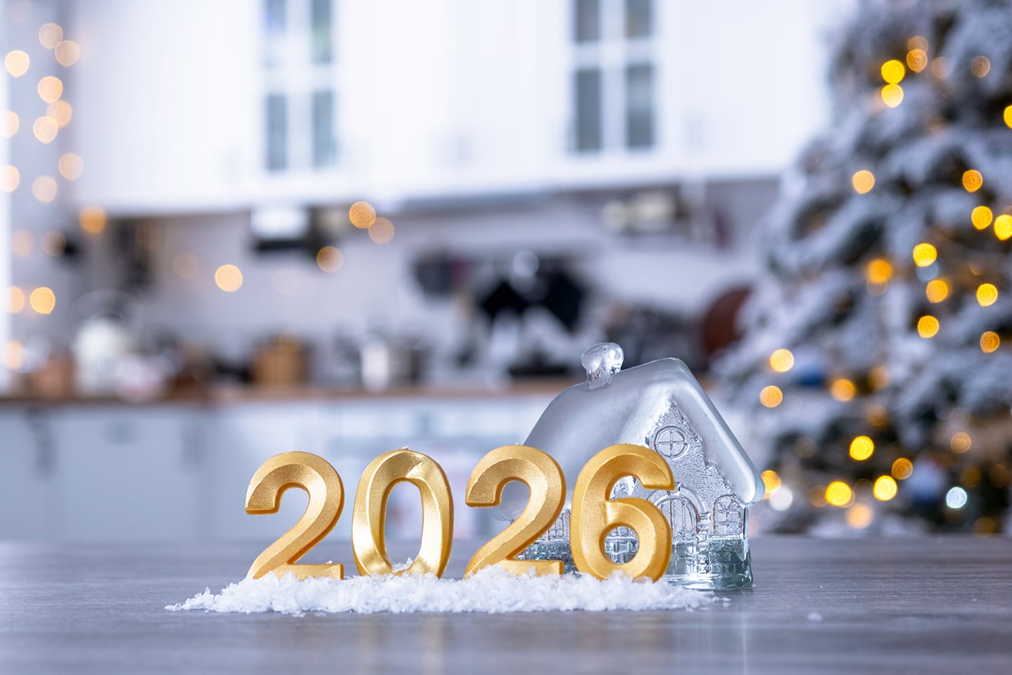 Golden number 2026 and tiny home on background of cozy white kit