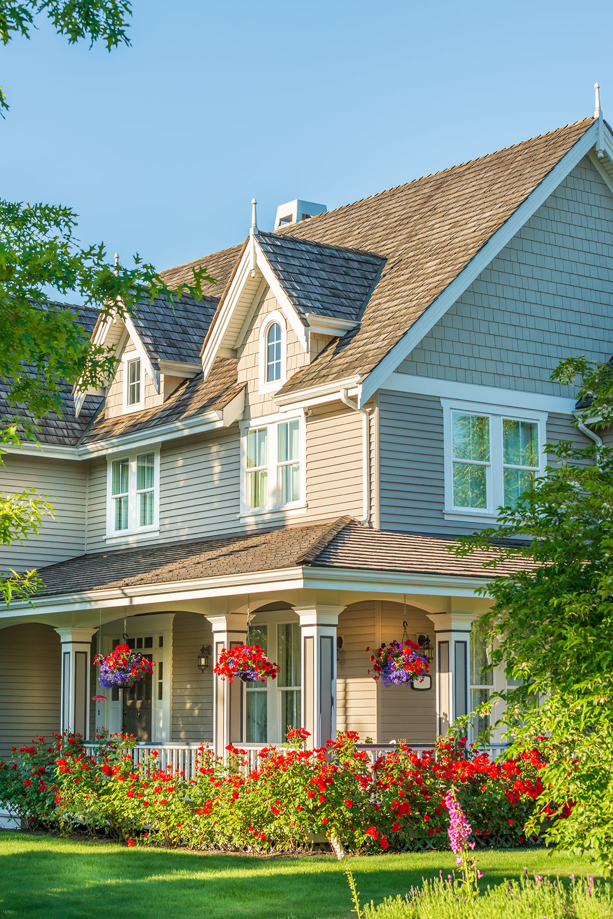 beautiful-house-with-red-flowers-in-suburban-setti-2026-03-26-11-35-21-utc