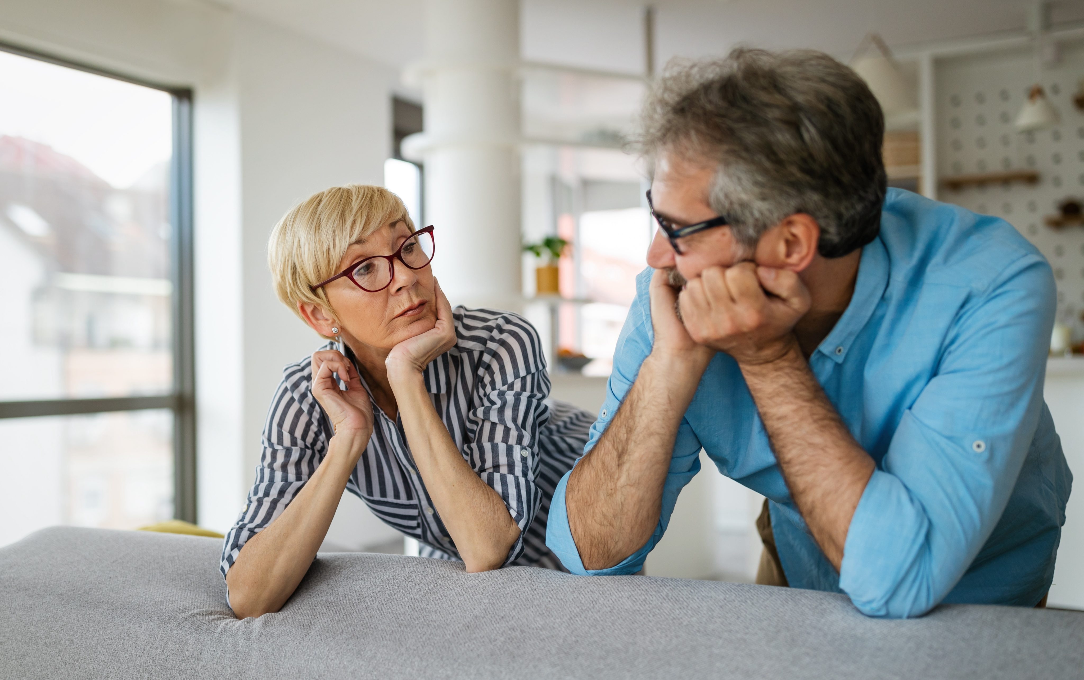 Handsome senior man and attractive old woman are having relationship problems