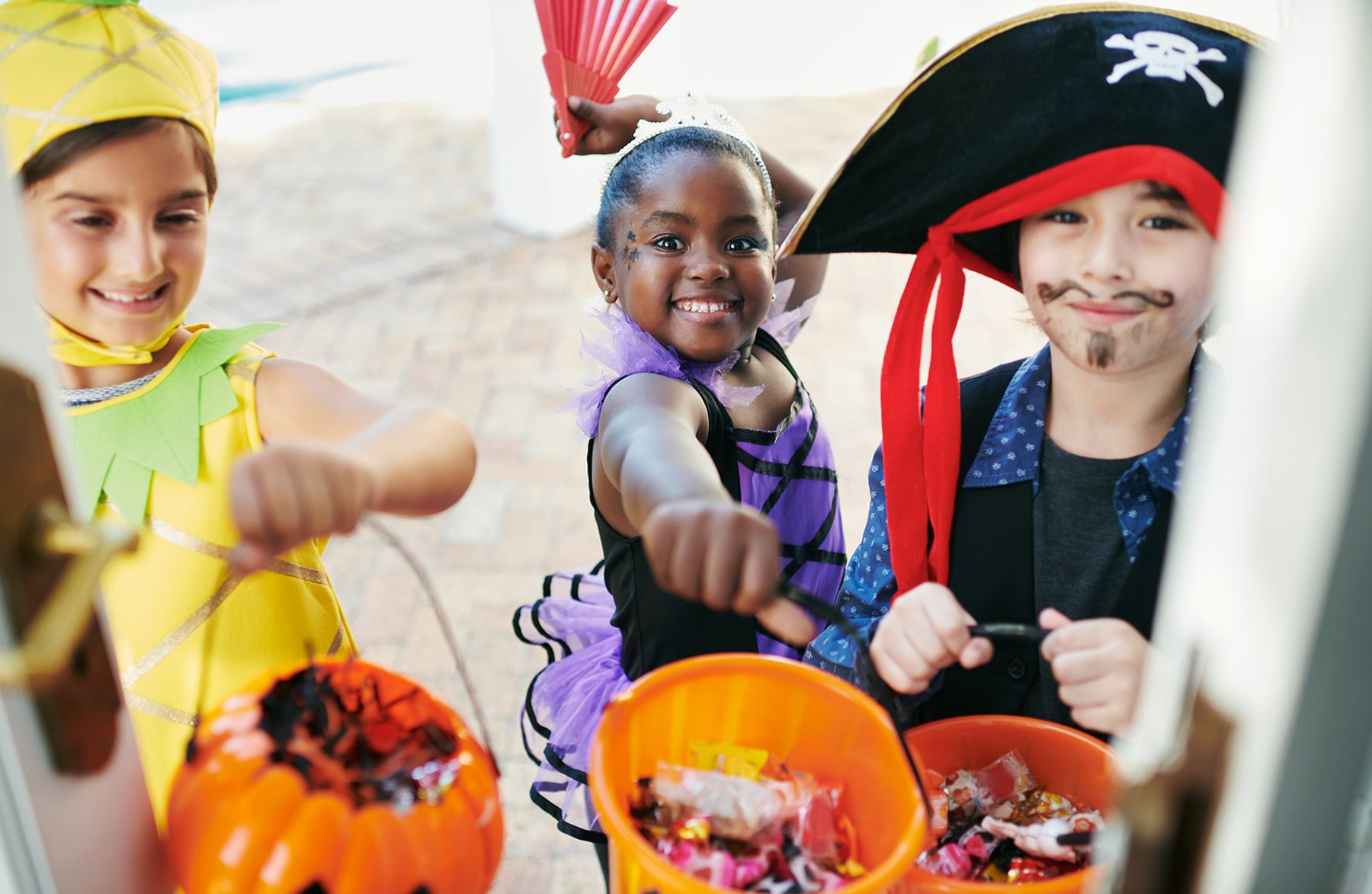 Candy time. Shot of a group of little children going trick-or-treating