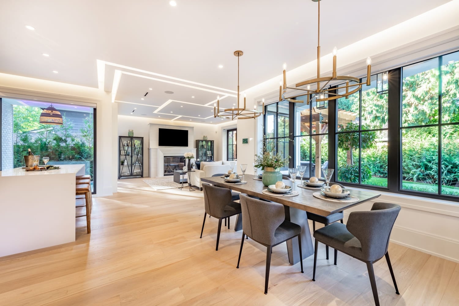 Elegant modern farmhouse interior kitchen dining with bar white marble charcoal grey chairs bar stools and decor