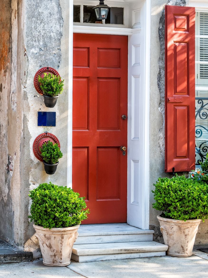 Charleston, USA downtown city street in South Carolina with nobody in southern town by old vintage houses architecture, narrow alley and door entrance vertical