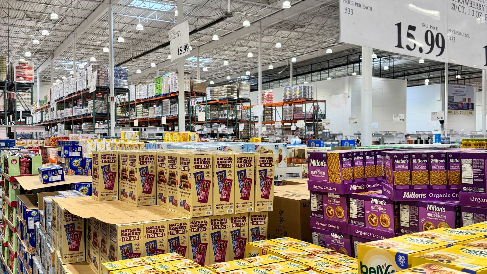 Interior of a Costco warehouse in Anchorage, Alaska with bulk grocery items and large price signs