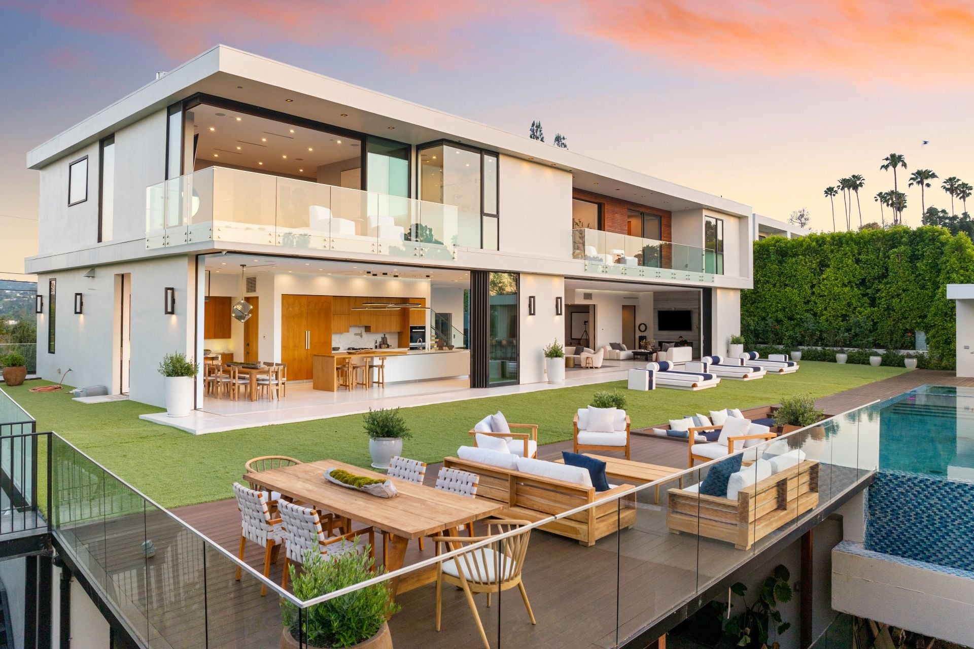 A Luxurious home patio with outdoor pool and glass doors