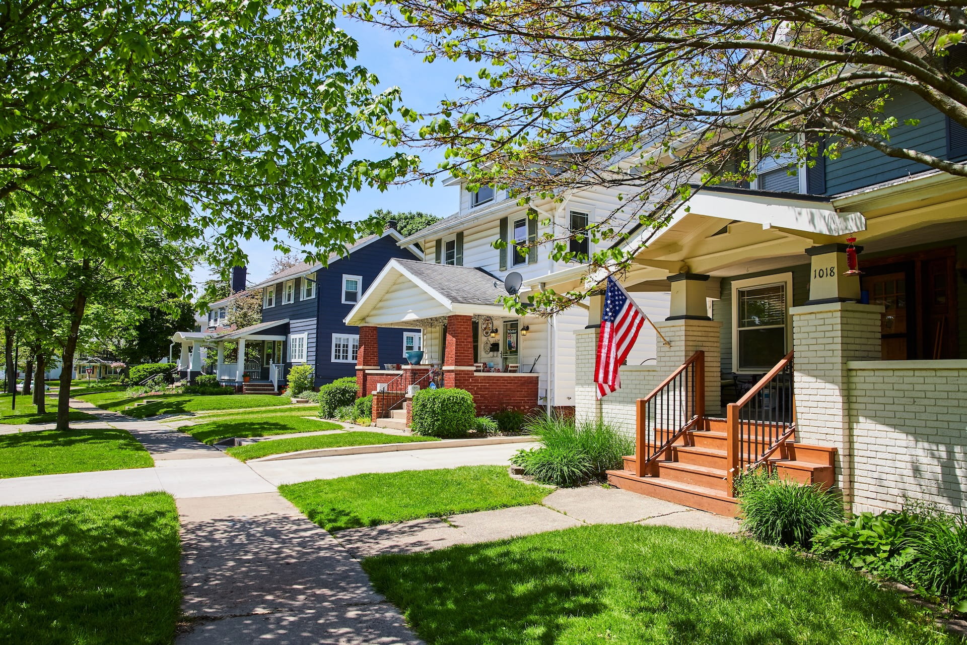 Charming American Townhouses with Flag, Sunny Suburban Street (1)