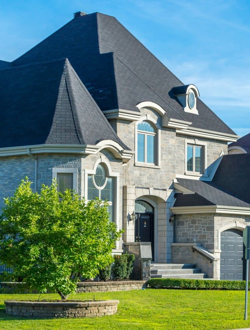 Luxury house in Montreal, Canada against blue sky vertical