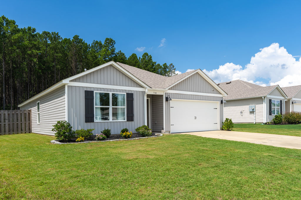 Angled curb view of a 2023-built one-level home in Chelsea Acres, Chelsea, Alabama