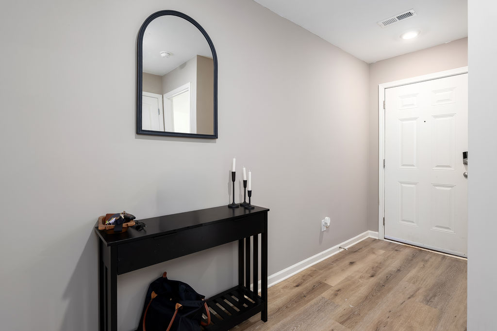 Entry foyer with luxury vinyl plank flooring in a Chelsea, Alabama home for sale