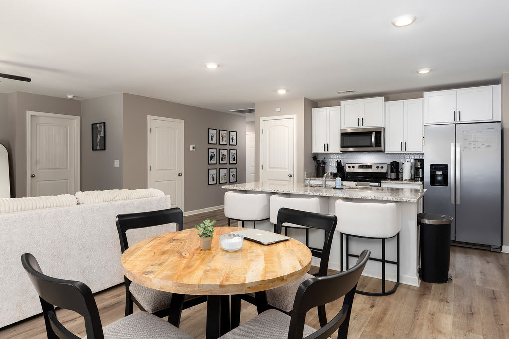 Open floor plan connecting kitchen, dining, and living areas in Chelsea, AL