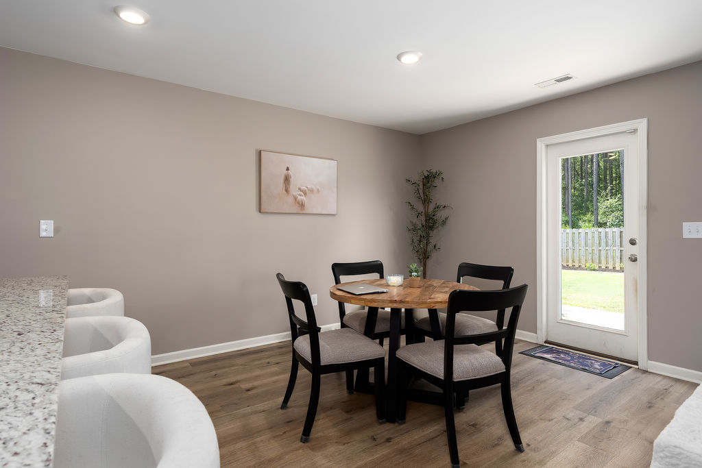 Dining area with rear door to the backyard at 741 Fish Camp Road, Chelsea, AL