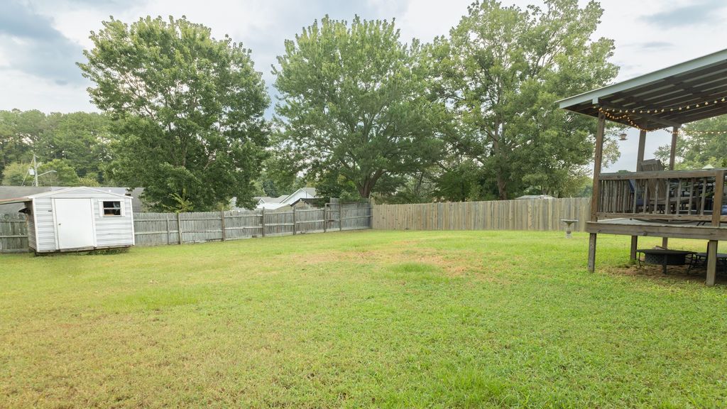 Huge flat fenced backyard and covered deck at 116 Dolphin Court, Alabaster, AL