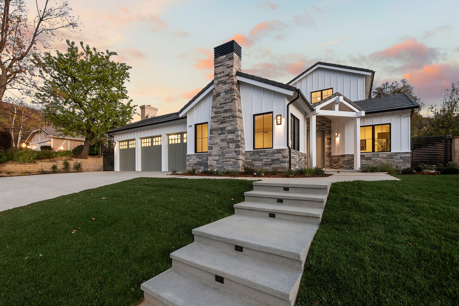 New modern farmhouse at 5540 E Napoleon Avenue at twilight