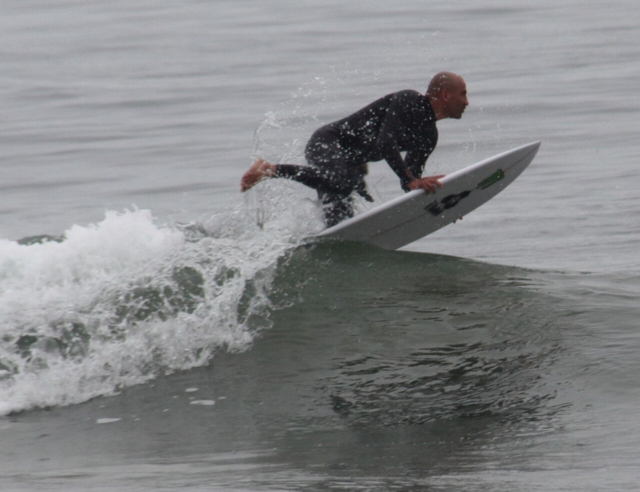 A surfer riding the point break at Rincon, on the Ventura–Santa Barbara county line